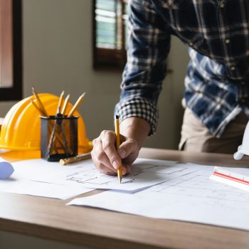 Engineer architect designer freelance work on start-up project drawing, construction plan